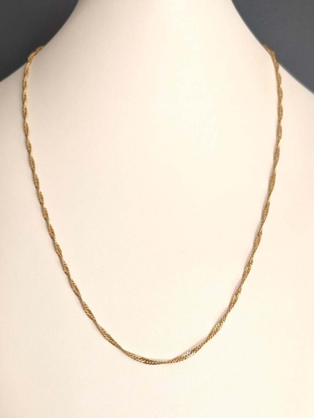 Gold tone twisted delicate chain necklace